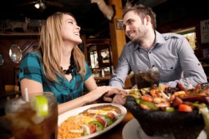 Close Couple Enjoying Dinner at a Mexican Food Restaurant