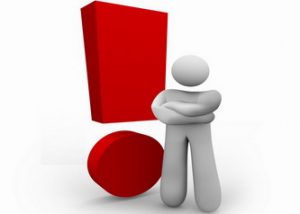 A person stands angrily beside a red exclamation mark