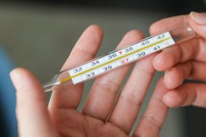 person-holding-thermometer-38731752