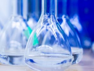 two-clear-glass-jars-beside-several-flasks-2481521